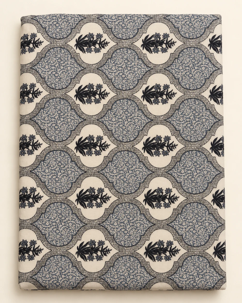 Charcoal Trellis printed bedsheet, folded to show its design