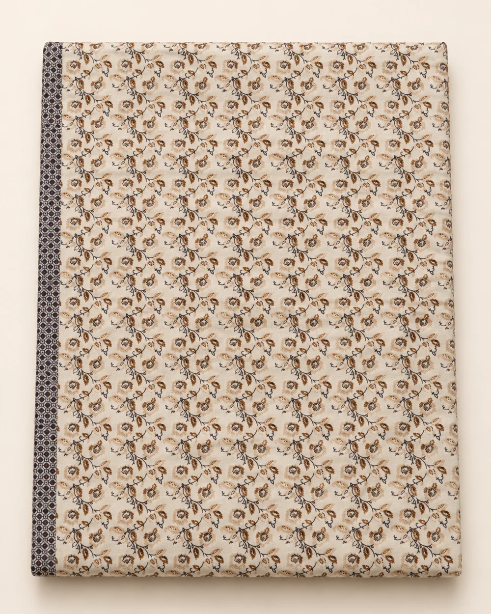 Petite Botanicals printed bedsheet, folded to show its design